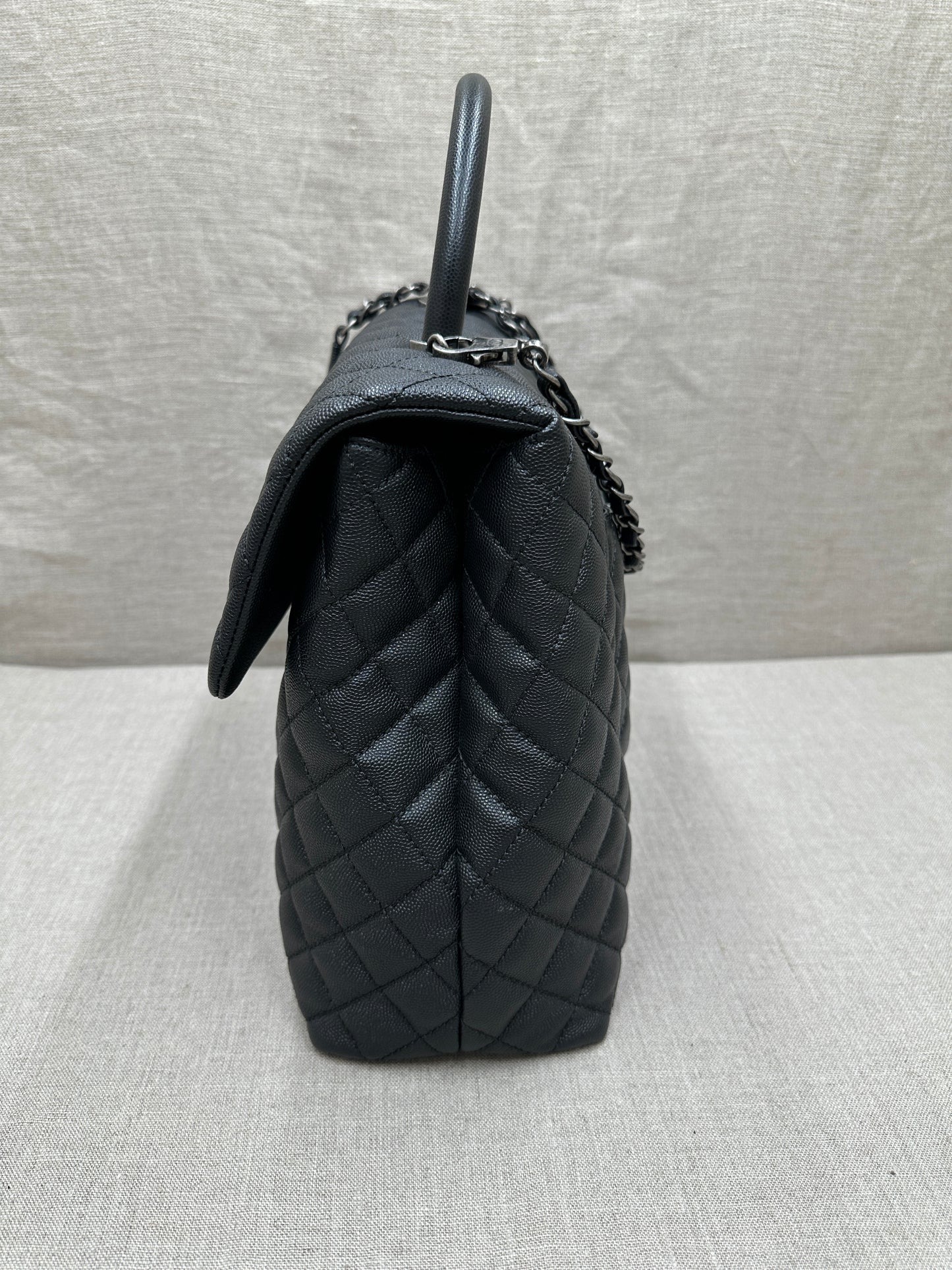 Chanel Maxi Flap Bag top handle
