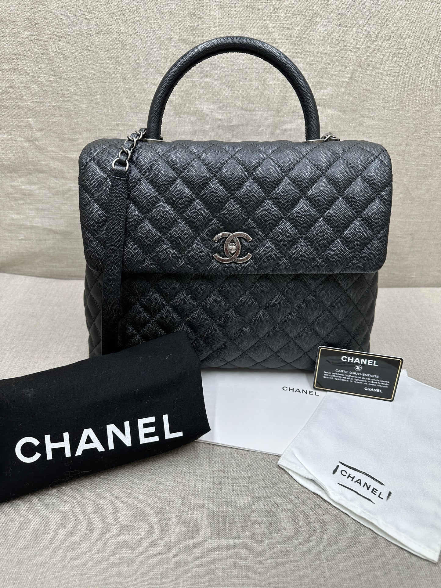 Chanel Maxi Flap Bag top handle