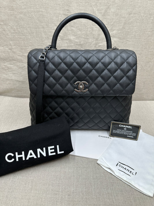 Chanel Maxi Flap Bag top handle