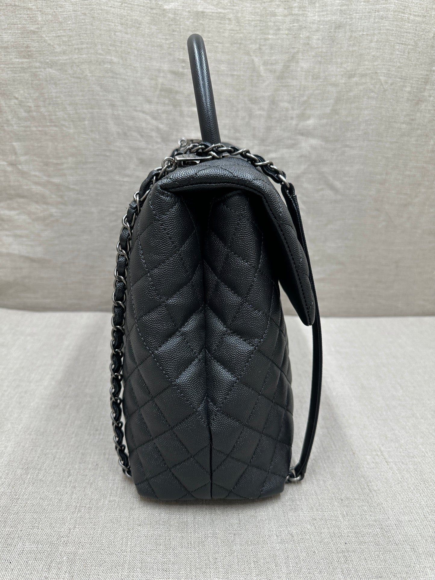 Chanel Maxi Flap Bag top handle