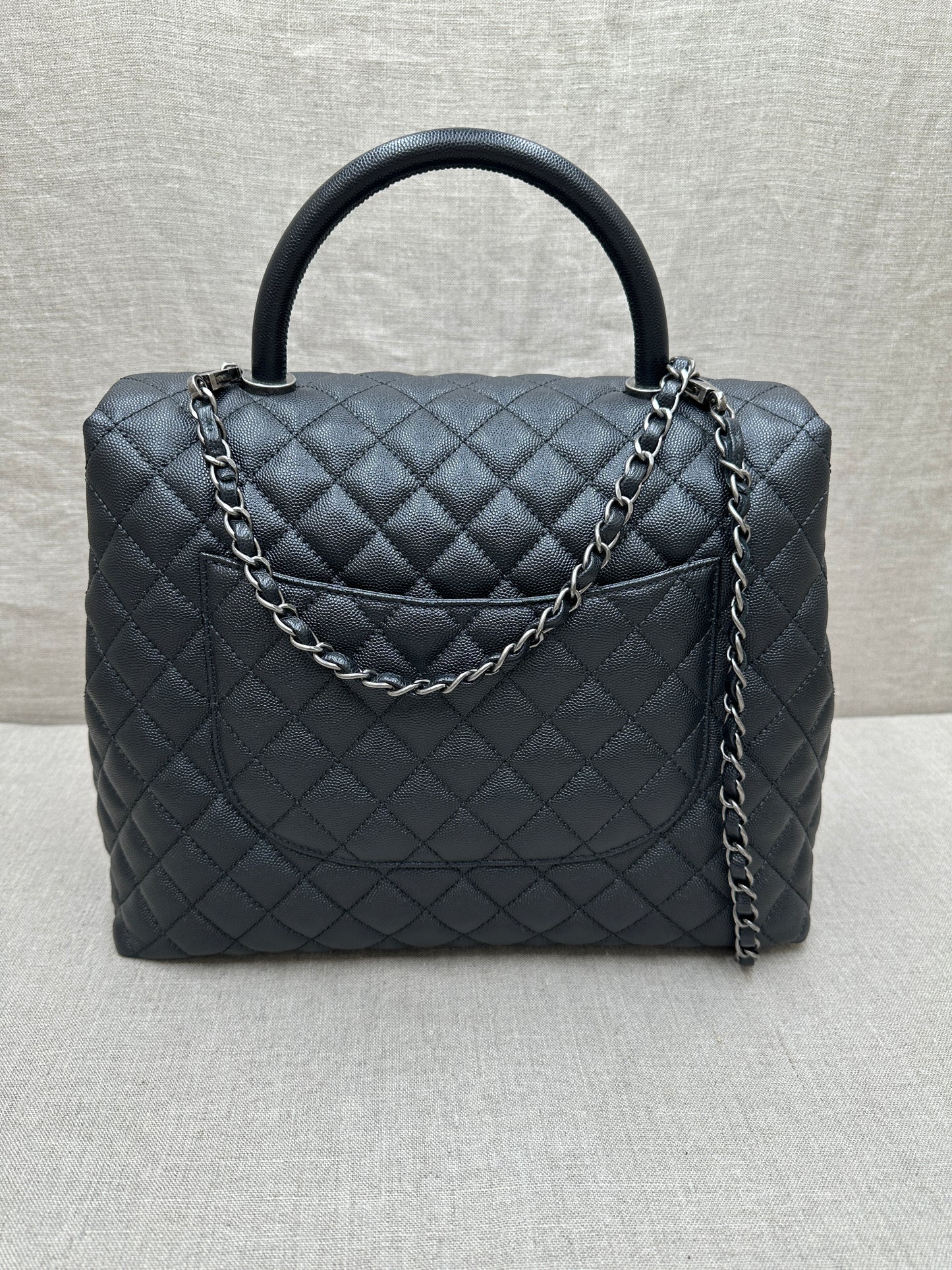 Chanel Maxi Flap Bag top handle