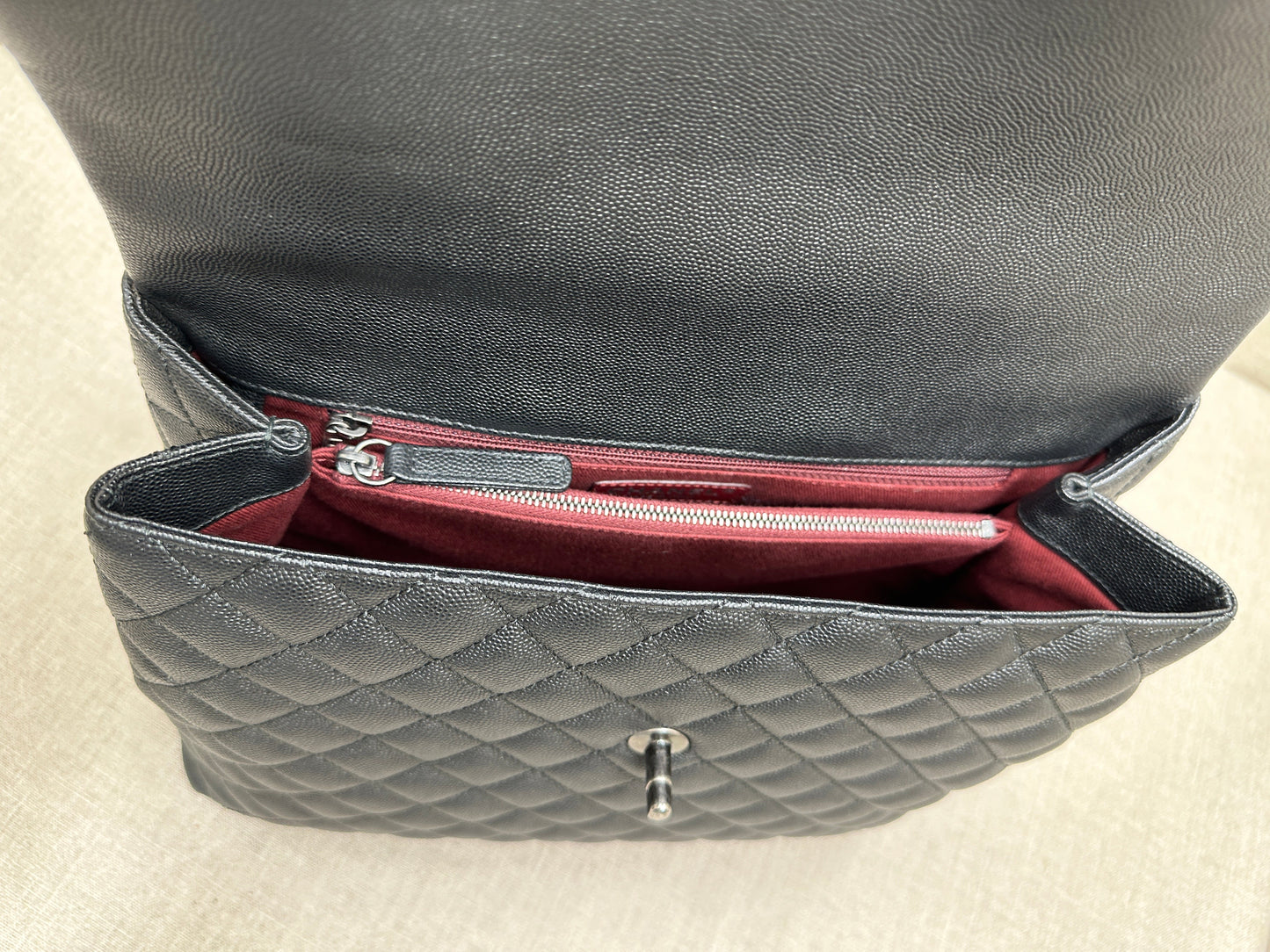 Chanel Maxi Flap Bag top handle