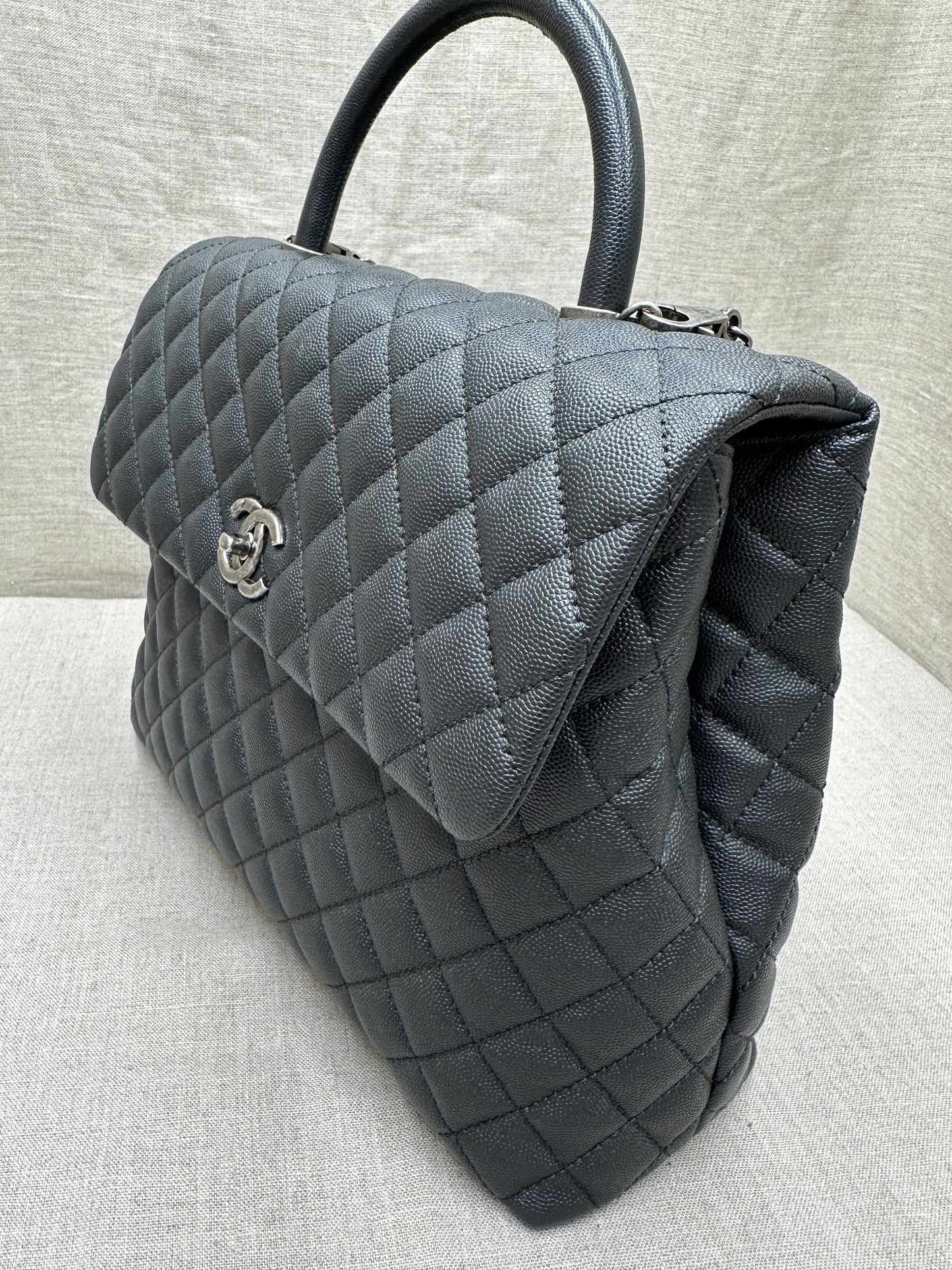 Chanel Maxi Flap Bag top handle